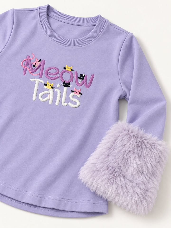 A lavender long-sleeve baby/toddler top with 'Meow Tails' embroidered on the chest, featuring small cat illustrations and a fluffy faux-fur cuff on one sleeve, shown on a light cream background.
