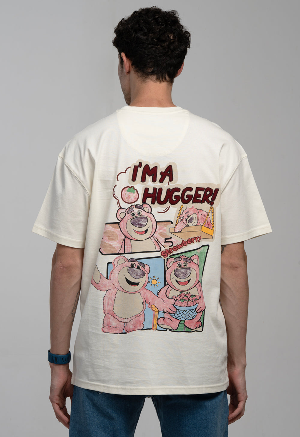 Person wearing a t-shirt with cartoon characters and text on the back
