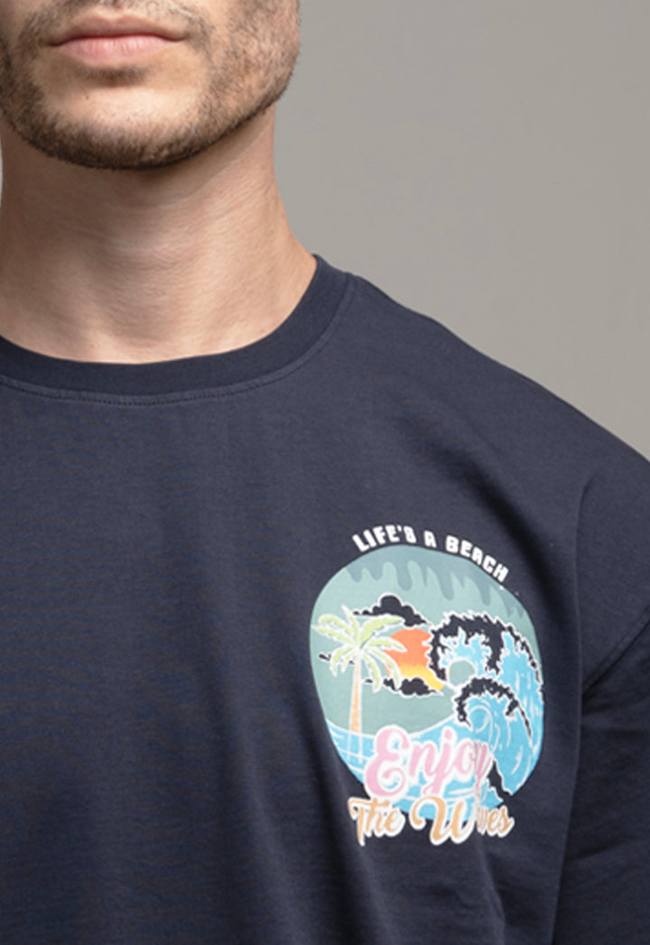 Navy blue sweatshirt with a beach graphic and text on a gray background