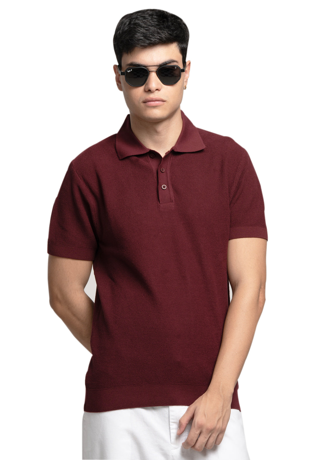 Man wearing a maroon polo shirt and sunglasses on a white background