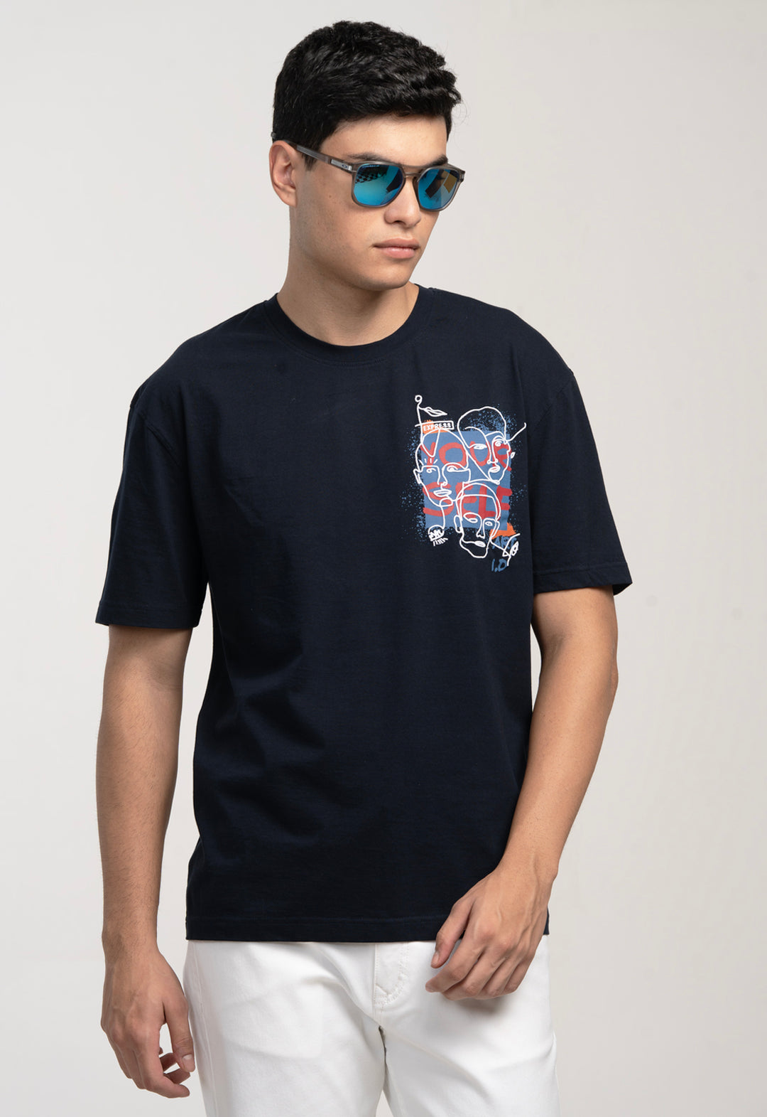 Man wearing a black t-shirt with a graphic design on a white background